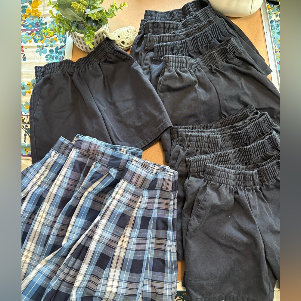 Girls blue pull on uniform shorts and skirts.